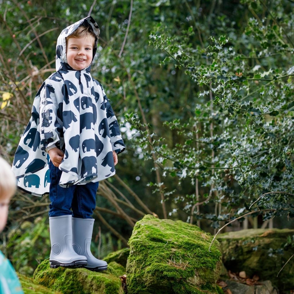 Toddler ponchos for 2-4 years old. Easy to pop on and fully waterproof and with a peaked hood to protect little faces. Seen here in an elephant design.