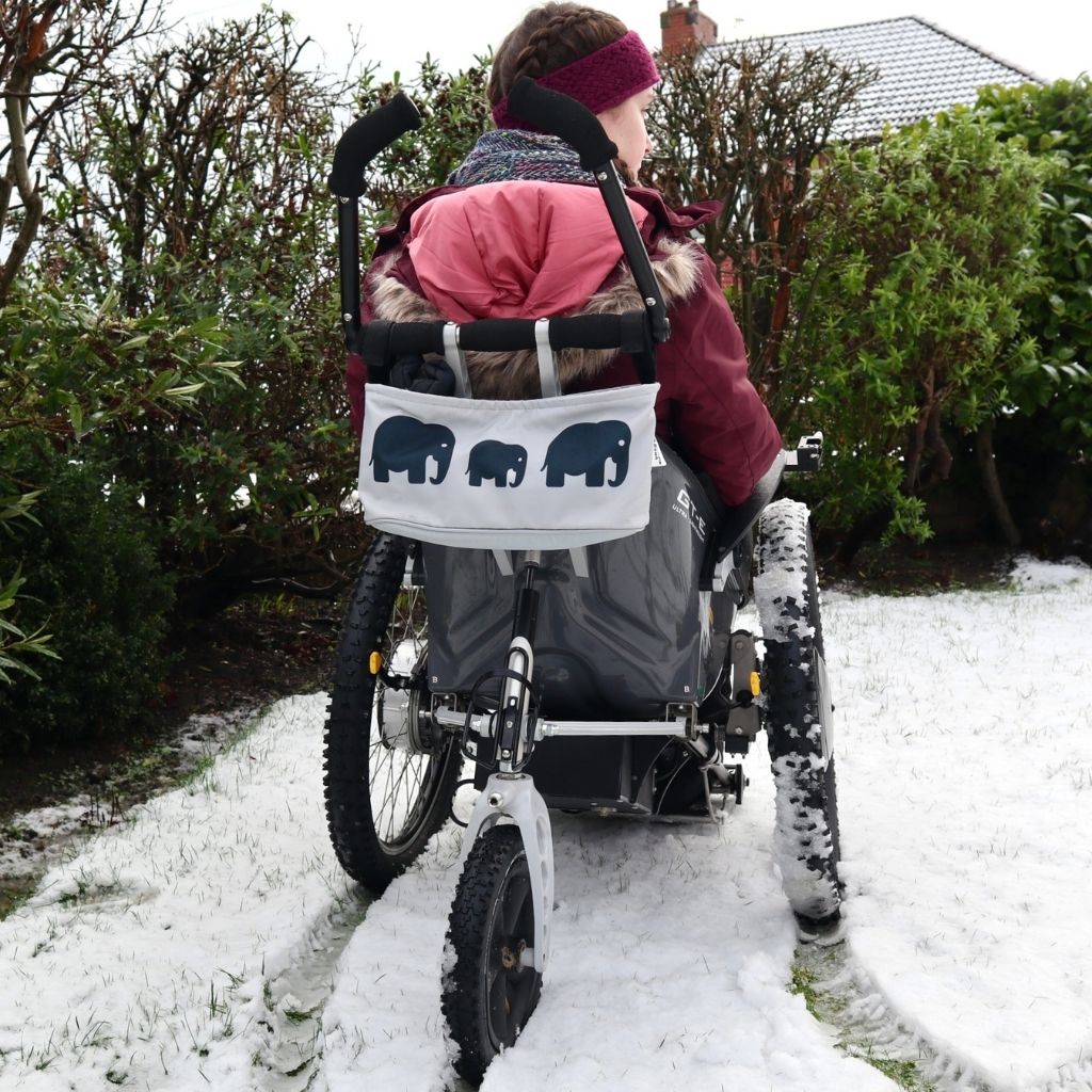 These handy wheelchair organiser bags fit on all wheelchairs, powerchairs, special needs buggies and rollators. Seen here in an elephant design with Lauren from Access your Life.