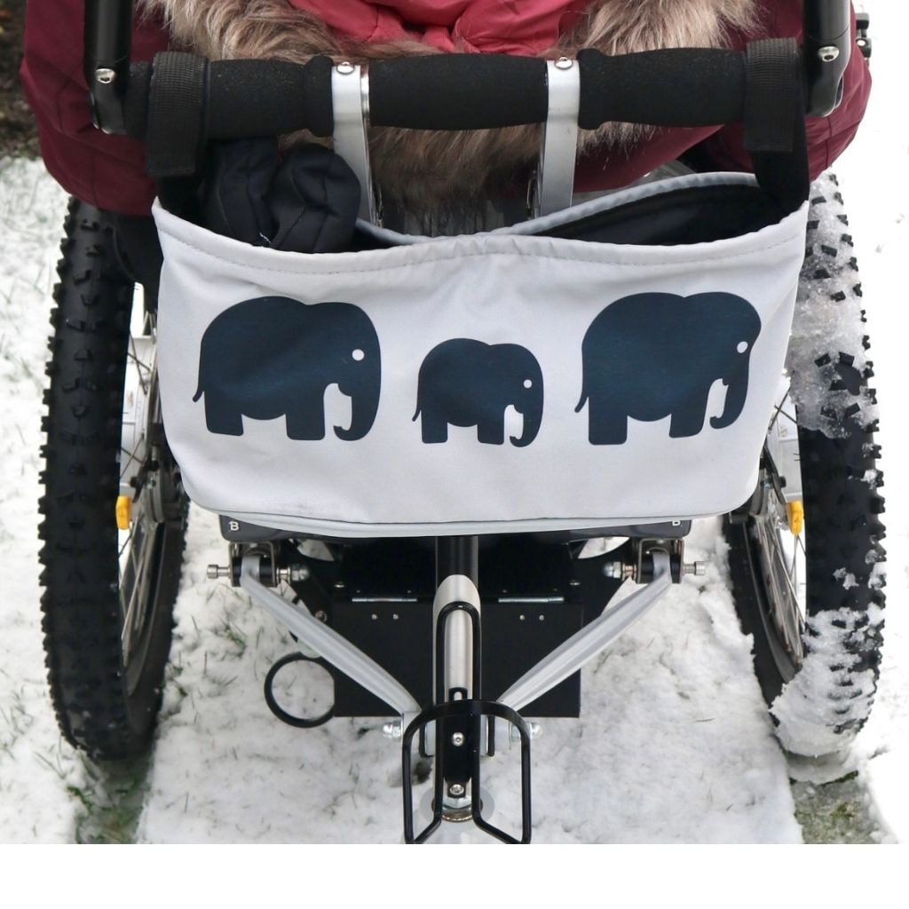 These handy wheelchair organiser bags fit on all wheelchairs, powerchairs, special needs buggies and rollators. Seen here in an elephant design.