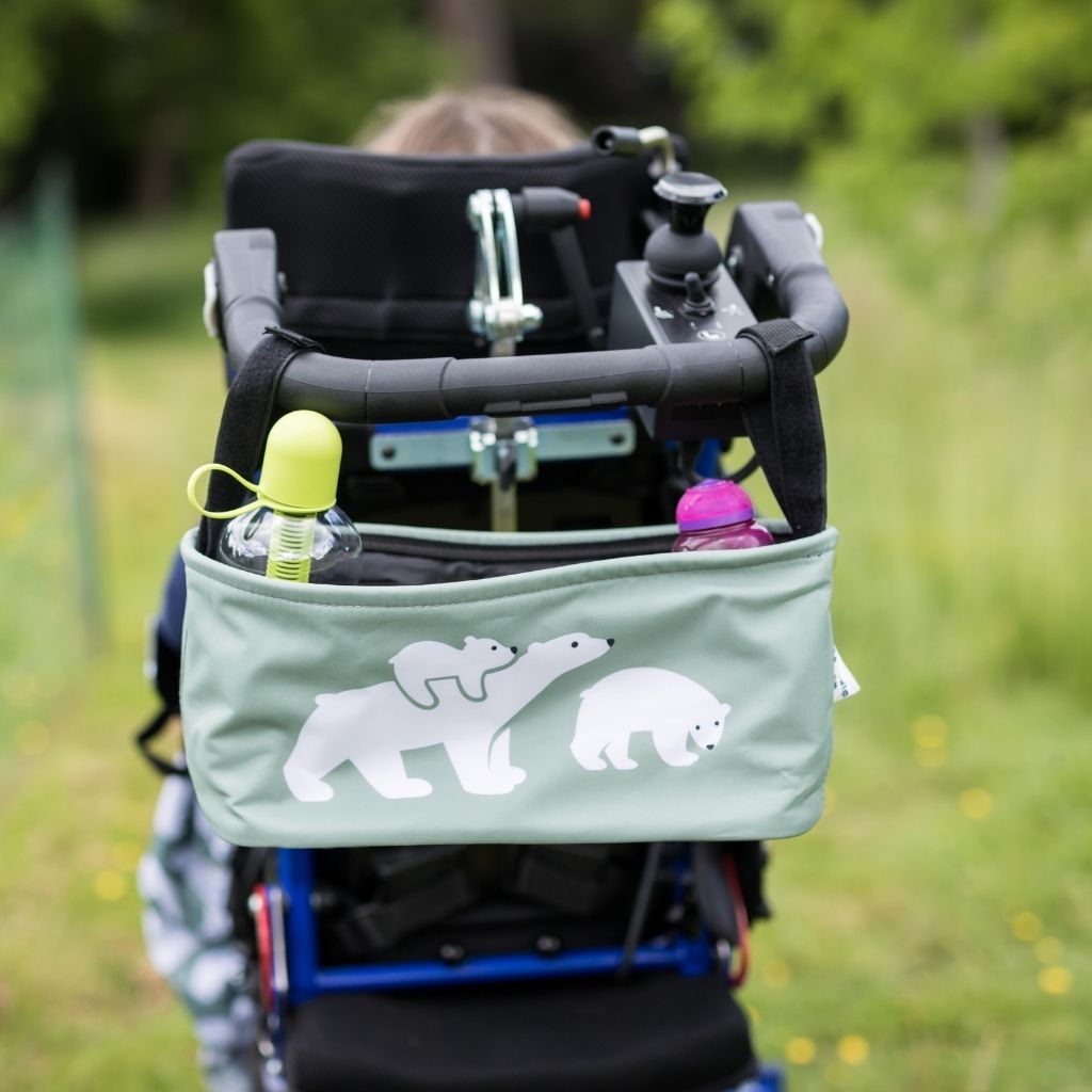 These handy wheelchair organiser bags fit on all wheelchairs, powerchairs, special needs buggies and rollators. Seen here in a polar bear design.