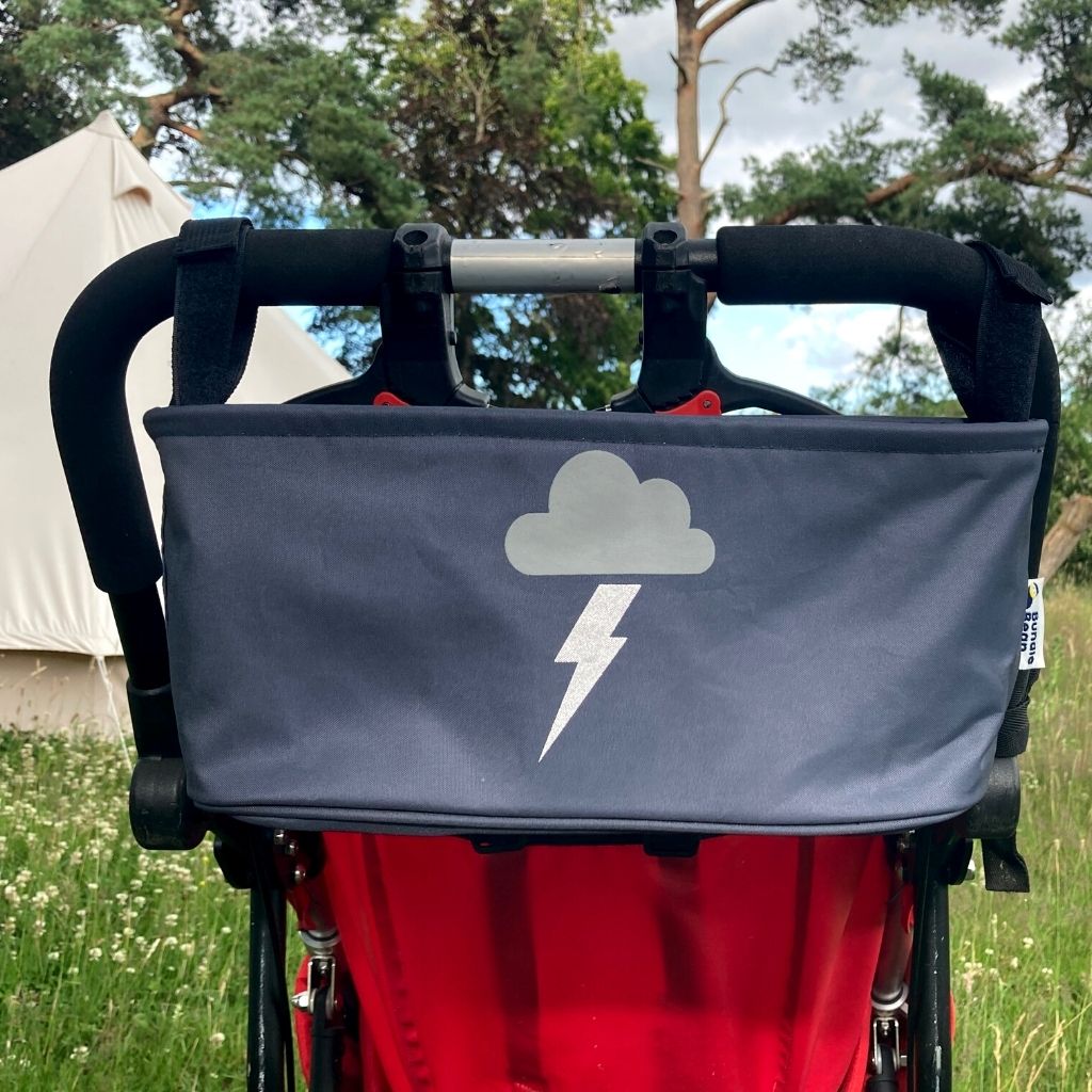 These handy wheelchair organiser bags fit on all wheelchairs, powerchairs, special needs buggies and rollators. Seen here in a silver lightning design.