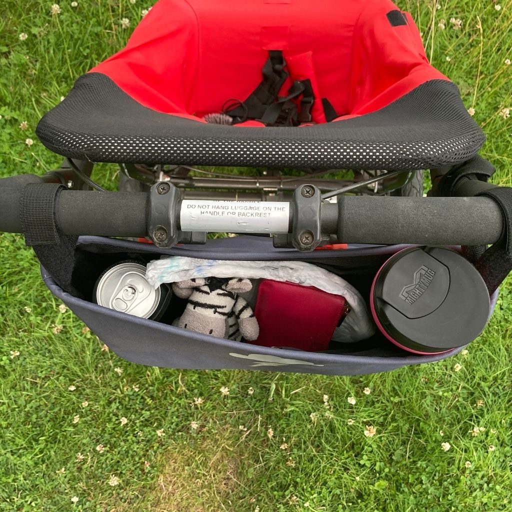 These handy wheelchair organiser bags fit on all wheelchairs, powerchairs, special needs buggies and rollators. Seen here in a silver lightning design.
