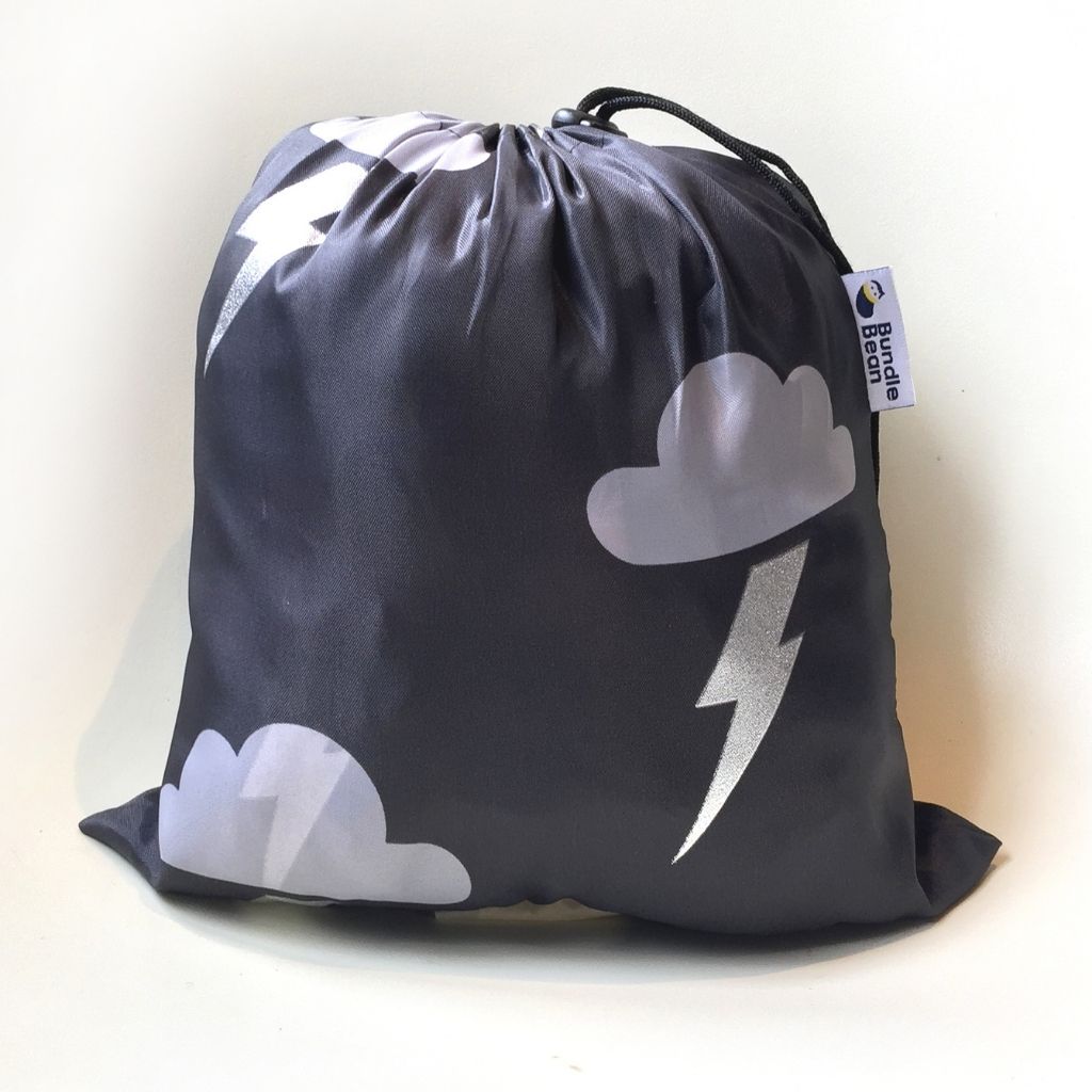 BundleBean Babywearing fleece-lined and waterproof cover in silver lightning design easily packed away in a sac.