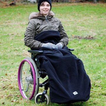 Our BundleBean Extreme double-layer fleece wheelchair blanket which can be attached to a liner.  Seen here in black.