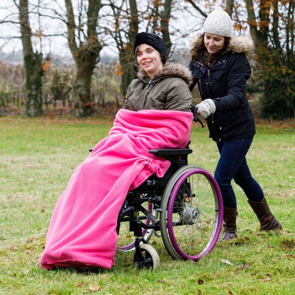 Our BundleBean Extreme double-layer fleece wheelchair blanket which can be attached to a liner. Seen here in fuschia