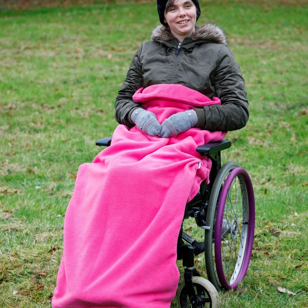 Our BundleBean Extreme double-layer fleece wheelchair blanket which can be attached to a liner.  Seen here in fuschia