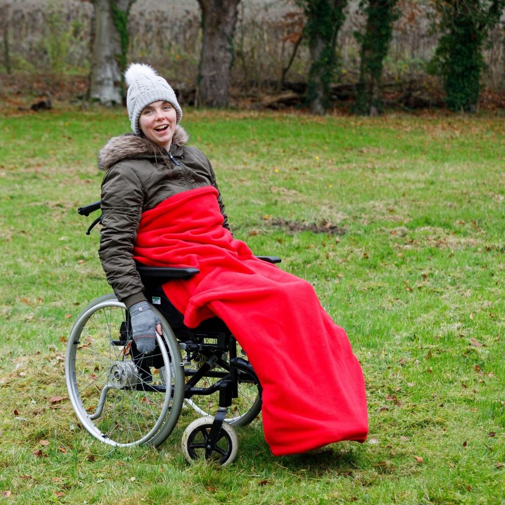 Our BundleBean Extreme double-layer fleece wheelchair blanket which can be attached to a liner. Seen here in red.