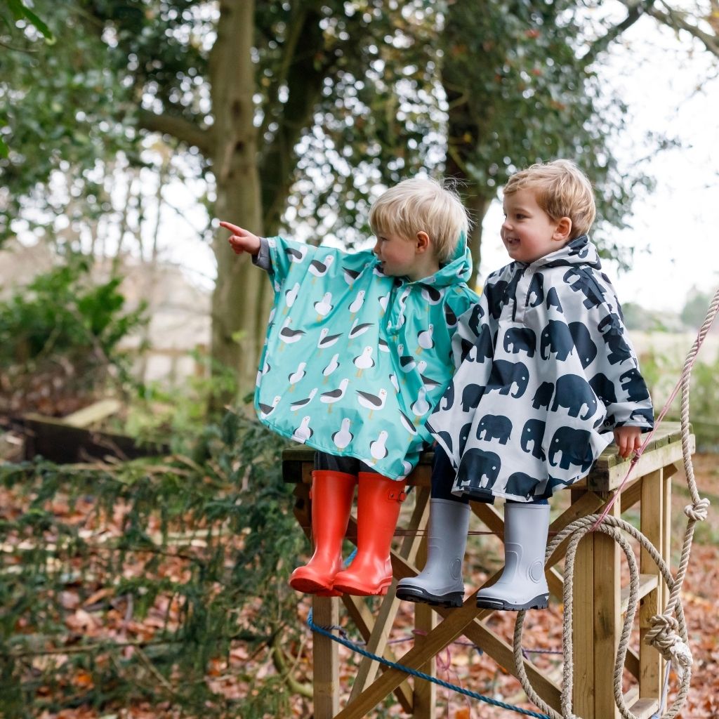 Toddler ponchos for 2-4 years old. Easy to pop on and fully waterproof and with a peaked hood to protect little faces. Seen here in an elephant and seagull design.