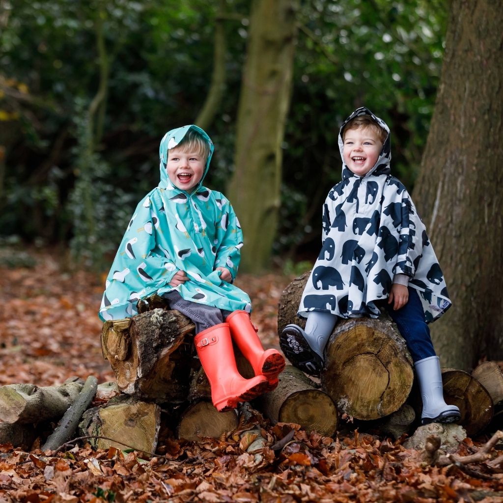 Toddler ponchos for 2-4 years old. Easy to pop on and fully waterproof and with a peaked hood to protect little faces. Seen here in an elephant and seagull design.