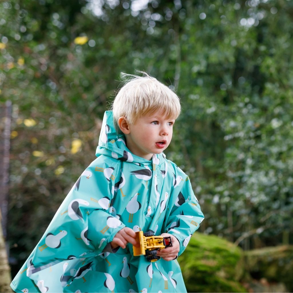 Toddler ponchos for 2-4 years old. A raincover that's easy to pop on and fully waterproof and with a peaked hood to protect little faces. Seen here in a seagull design.