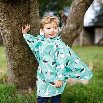 Toddler ponchos for 2-4 years old. Easy to pop on and fully waterproof and with a peaked hood to protect little faces. Seen here in a seagull design.