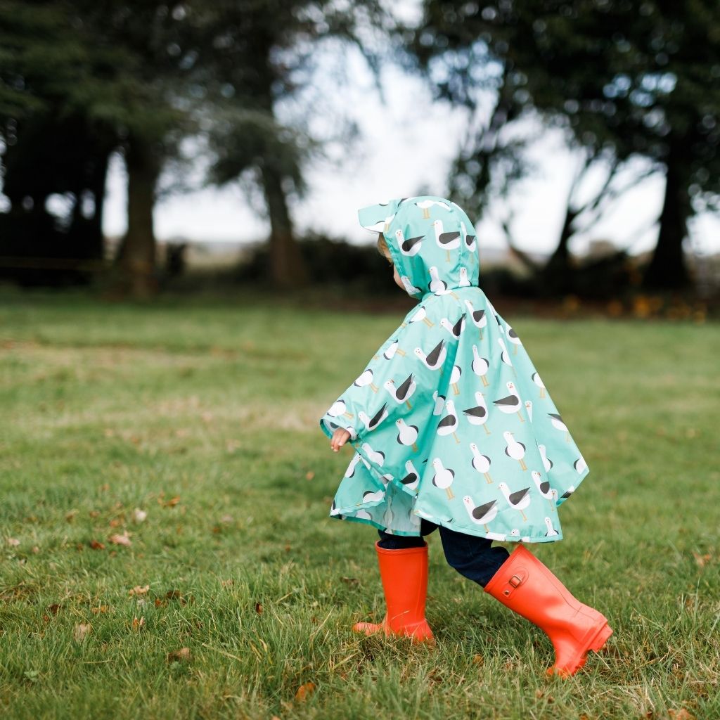 Toddler ponchos for 2-4 years old. A raincover that's easy to pop on and fully waterproof and with a peaked hood to protect little faces. Seen here in a seagull design.