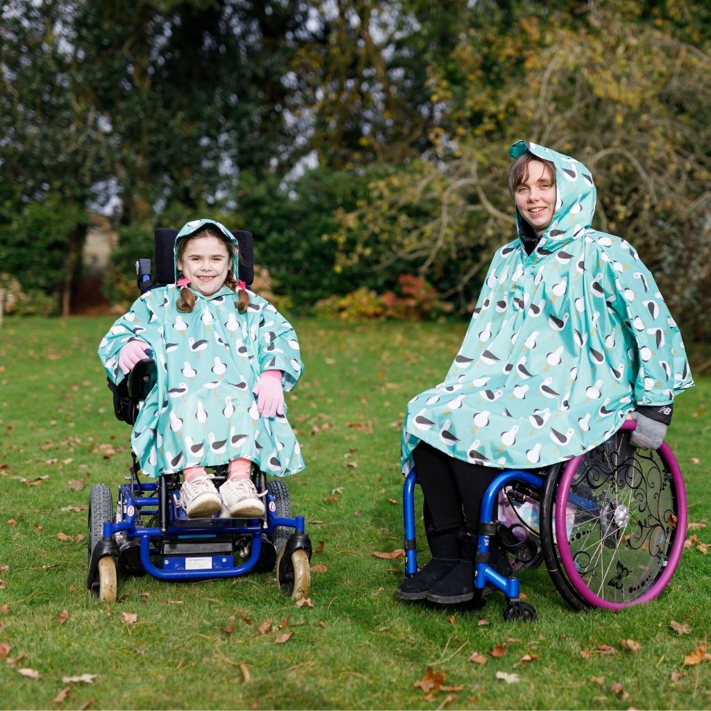 Fully waterproof adult  and kids wheelchair poncho with a peaked hood to protect faces from the rain. In seagull design.
