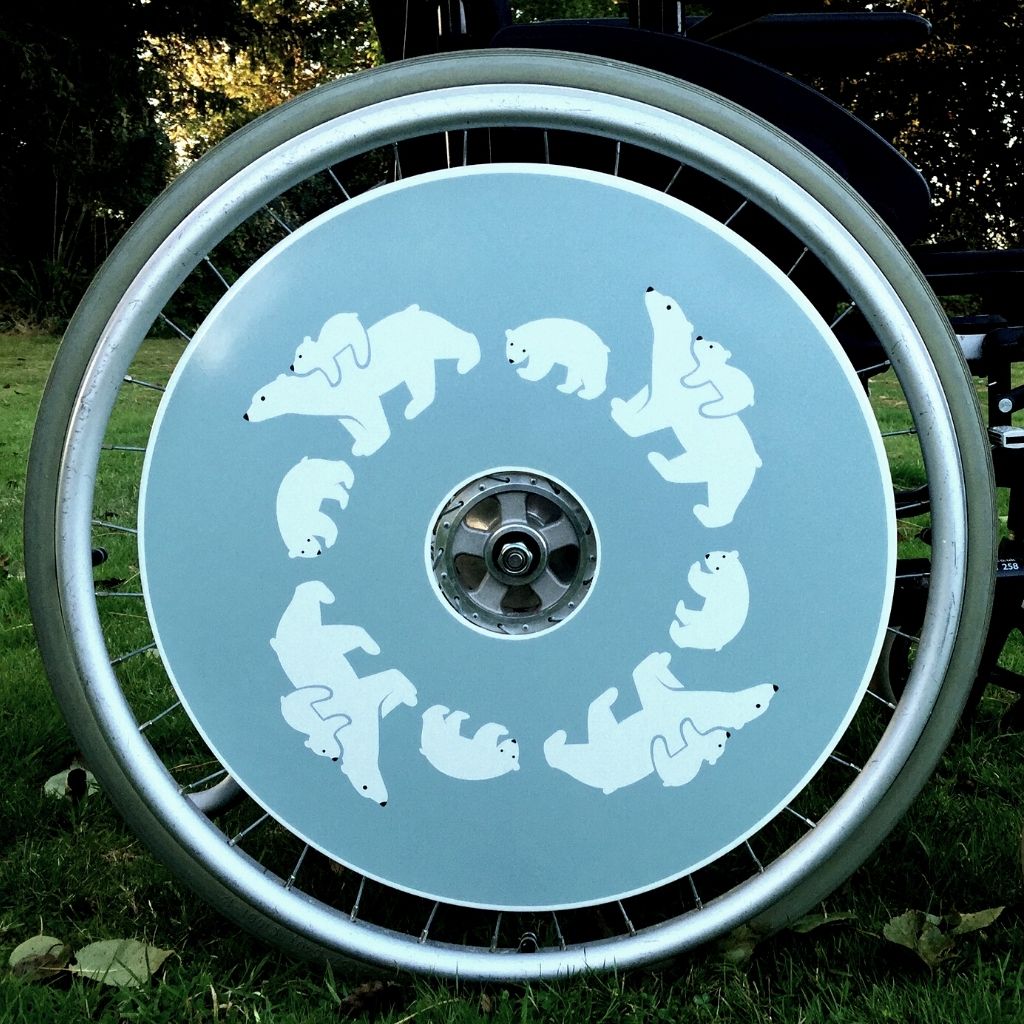 Wheelchair spokeguard custom made to order in a polar bear design. Match with your wheelchair cosy.