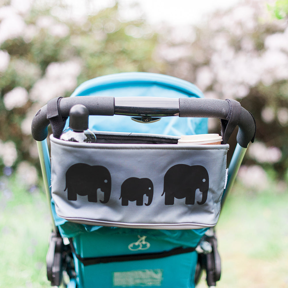 These handy buggy organiser bags fit to your handlebars – perfect for everyday essentials! Seen here in elephant design.