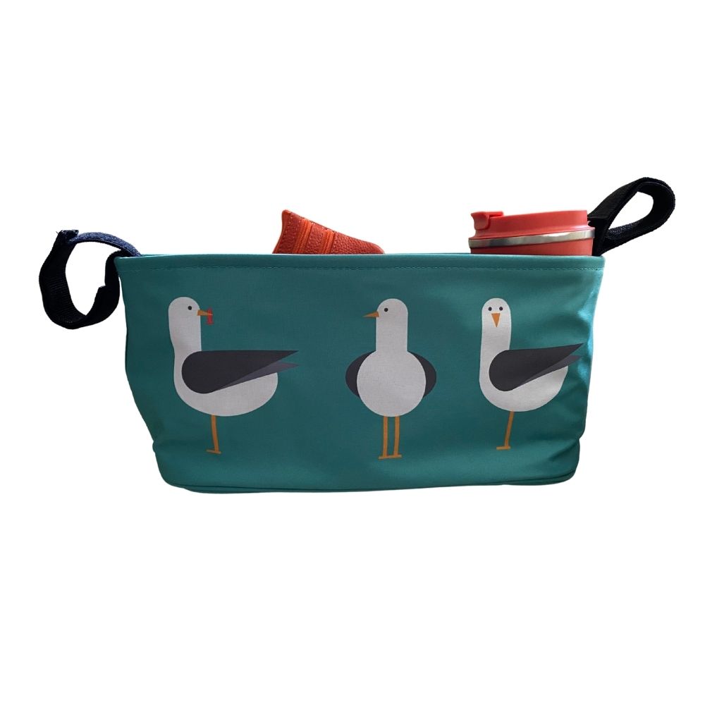 These handy buggy organiser bags fit to your handlebars – perfect for everyday essentials! Seen here in seagulls design.