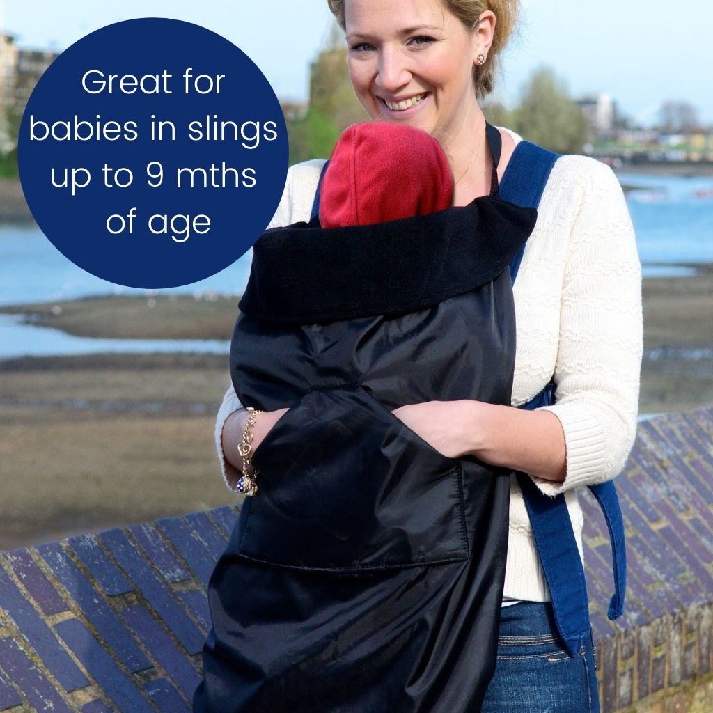 The BundleBean GO is a waterproof footmuff for babies and toddlers that fits snugly on to buggies, bike seats, car seats and baby carriers. Seen here on a baby in a sling and in black.