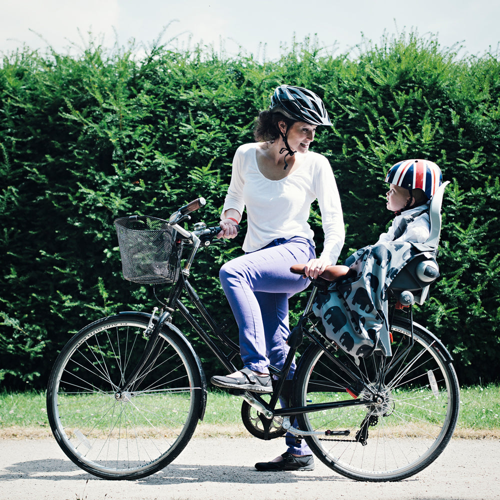 The BundleBean GO is a waterproof footmuff for babies and toddlers that fits snugly on to buggies, bike seats, car seats and baby carriers. Seen here on  a bike seat and in an elephant design